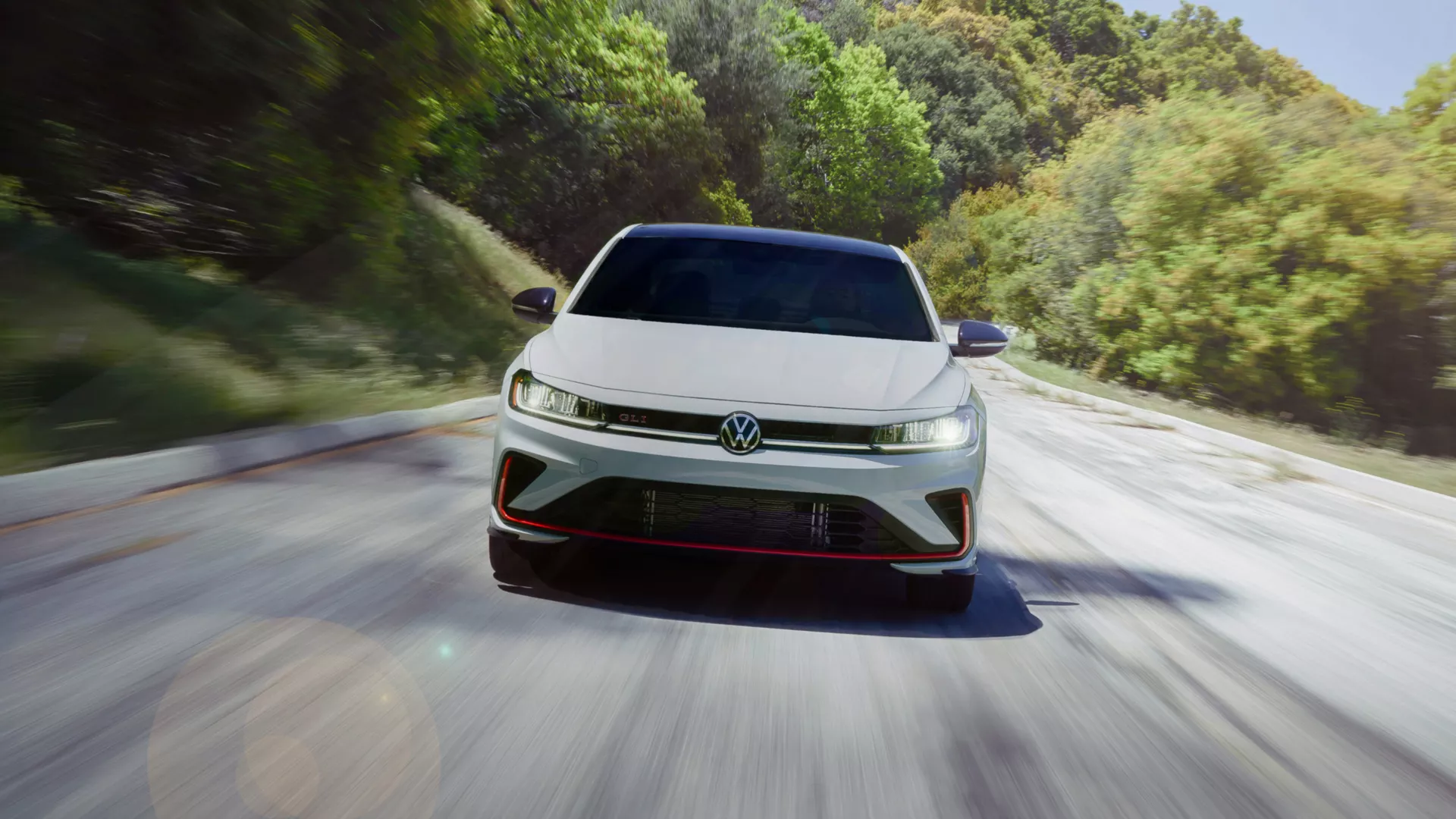 2026 Volkswagen Jetta GLI driving on coastal road